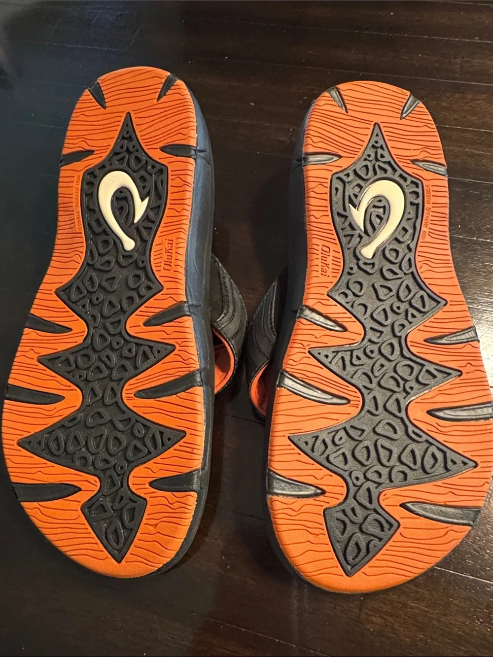 OluKai Men's Black Flip-Flops with Orange Accents